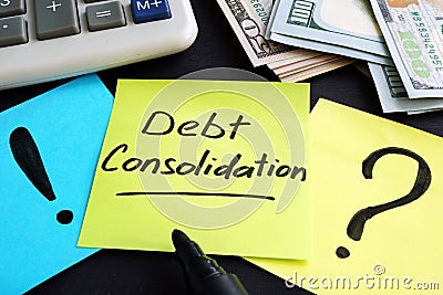 Debt consolidation written by hand and money. Stock Photo