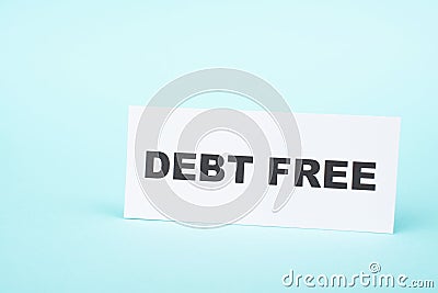 Debt free in process, ending credit payments and bank loans, financial freedom, message on paper Stock Photo