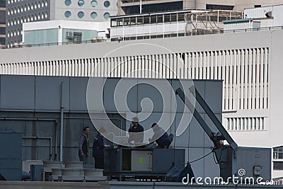 1 Dec 2007 a Building workers in yellow vests turning Editorial Stock Photo