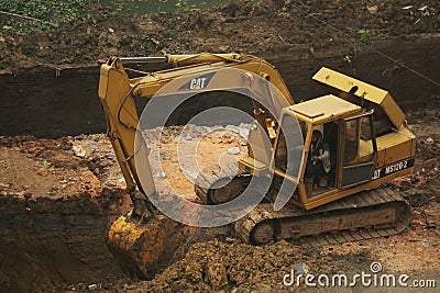09-Dec-2020, Dhaka, Bangladesh.Construction work is going on with the excavator Editorial Stock Photo