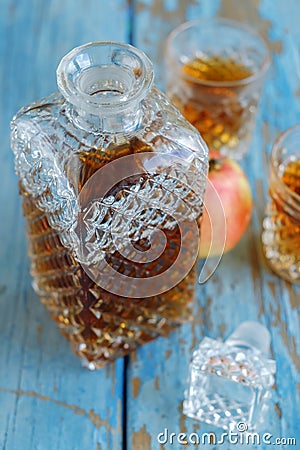 Decanter, glasses and apple on the table Stock Photo