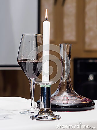 Decanter, wine glass, candle for wine tasting Stock Photo