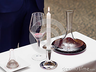 Decanter, wine glass, candle for wine tasting Stock Photo