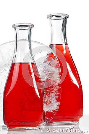 Decanters with piece of ice Stock Photo