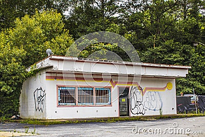 Old urban building with bars on the window on Candler road Editorial Stock Photo