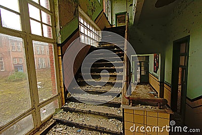 Staircase in an abandoned old school building Stock Photo