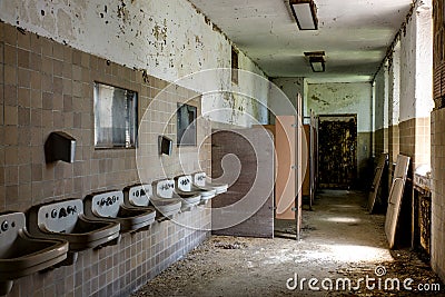 Crumbling Bathroom with Sinks - Abandoned Hospital Stock Photo