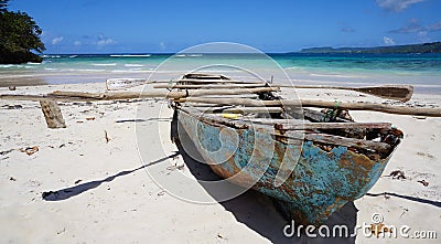 Decaying rowing boat on beach at Playa RincÃ³n Stock Photo