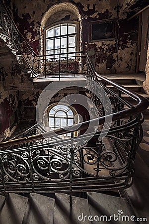 Decaying staircase in an abandoned house Stock Photo