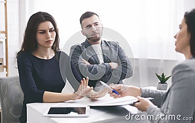 Deceived couple disputing about mortgage loan with realtor Stock Photo