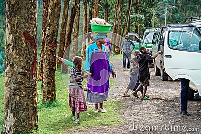 December, 2019. Africa, Uganda, scenes from African life, an African woman and children Editorial Stock Photo