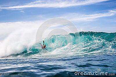 December 30, 2020. Bali, Indonesia. Bodyboarder ride on bodyboard at big wave. Professional surfing in ocean at waves Editorial Stock Photo