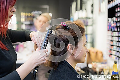December 10, 2022 Balti Moldova. The process of hair styling. Illustrative editorial Editorial Stock Photo