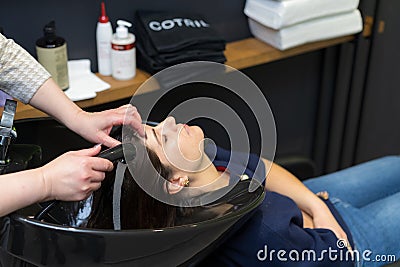 December 10, 2022 Balti Moldova. The process of washing hair in a beauty salon. Illustrative editorial Editorial Stock Photo