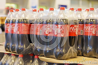 December 2, 2021 Beltsy Moldova. Illustrative editorial. Packages of bottles of Coca-Cola at a retail grocery store Editorial Stock Photo