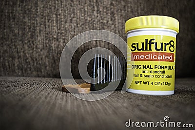 1 December 2019 - Calgary , Alberta Canada - A jar of Sulfur 8 medicated hair cream with a comb Editorial Stock Photo