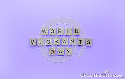 International Migrants Day, minimalistic banner with the inscription in wooden letters Stock Photo