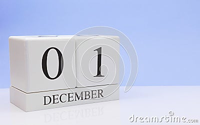 December 01st. Day 1 of month, daily calendar on white table with reflection, with light blue background. Winter time, empty space Stock Photo
