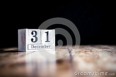 December 31st, 31 December, Thirty First of December - White block calendar on vintage table - Date on dark background Stock Photo