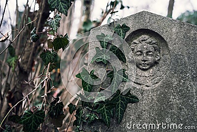 Angel Face Carved on Old Gravestone Editorial Stock Photo