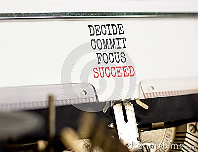 Decide commit focus succeed symbol. Concept word Decide Commit Focus Succeed typed on old retro typewriter. Beautiful white paper Stock Photo