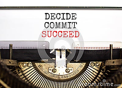 Decide commit succeed symbol. Concept word Decide Commit Succeed typed on beautiful retro old typewriter. Beautiful white paper Stock Photo