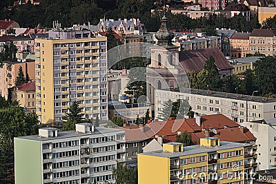 Decin, Czech republic - June 14, 2019: church between panel houses viewed from Pastyrska stena view at summer sunset Editorial Stock Photo