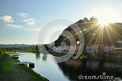 Decin, Czech republic - September 08, 2018: Pastyrska stena hill with lock, historical houses and Elbe river in Decin city during Editorial Stock Photo