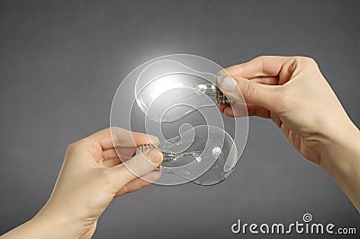 Decision making concept, hands with light bulbs. Stock Photo