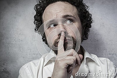 Decisionmaking, man in white shirt with funny expressions Stock Photo