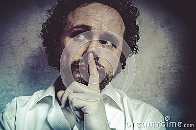 Decisionmaking, man in white shirt with funny expressions Stock Photo