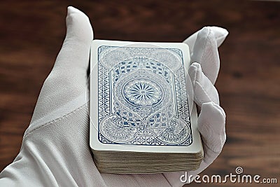 A deck of cards being held in a magicians hand Stock Photo