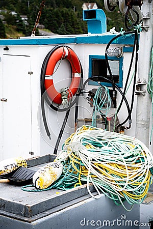 Deck of a East coast fishing boat with safety gear and fishing ropes in Newfoundland. Stock Photo