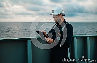 Deck Officer on deck of offshore vessel or ship , wearing PPE personal protective equipment Stock Photo