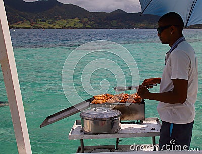 Deckhand cooking on a yacht Editorial Stock Photo