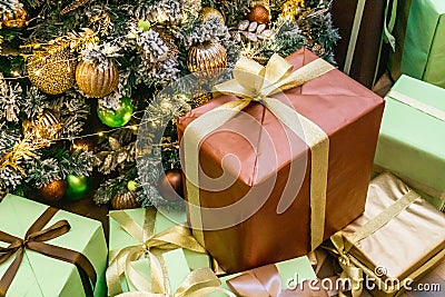 Decorated boxes with New Year gifts tied with ribbons Stock Photo