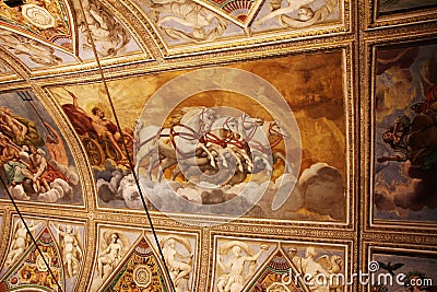 Decorated ceiling with frescos of a cart with horses in the museum Palazzo Te in Mantova, Italy Editorial Stock Photo
