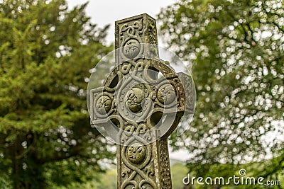 A decorated Celtic cross monument in nature. Stock Photo