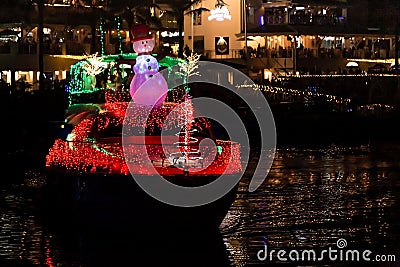 Decorated Christmas boat in Marina Pez Vela in Quepos, Costa Rica Stock Photo