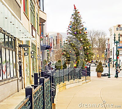 Ornamental guardrail leading to urban Christmas tree Stock Photo