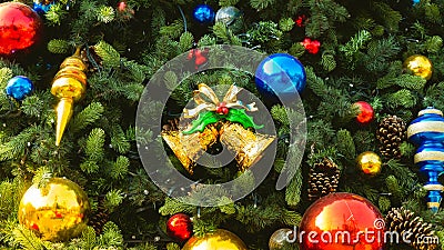Decorated Christmas tree with colorful Christmas ball and gold bell adorn Stock Photo