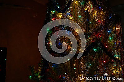 Christmas tree with decorations and garland close-up Stock Photo