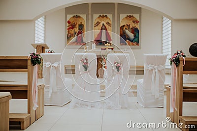 Decorated church for a wedding ceremony with chairs Stock Photo