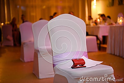 Decorated empty chairs at wedding party. Dancefloor Stock Photo
