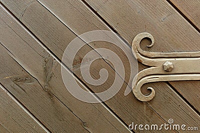 Decorated fitting on wooden door Stock Photo