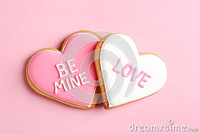 Decorated heart shaped cookies on color background, top view. Stock Photo