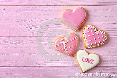 Decorated heart shaped cookies on wooden background, flat lay with space for text Stock Photo