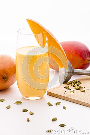 Decorated Mango Milk Shake And Crushed Cardamon Stock Photo