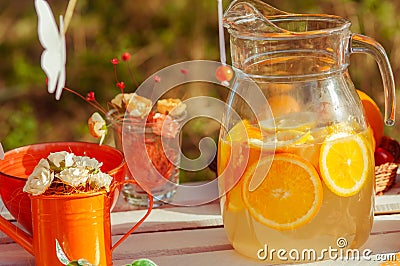 Decorated picnic with oranges and lemonade in the summer Stock Photo