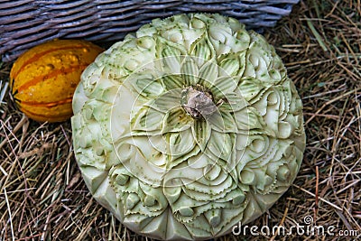 decorated pumpkin. carvings in a decorative pumpkin. Harvest festival. Craftsmanship Stock Photo